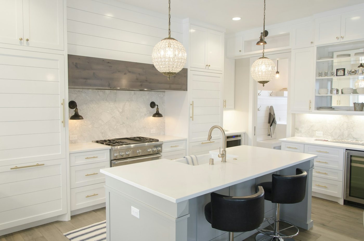 White shaker kitchen with island and pendant lighting